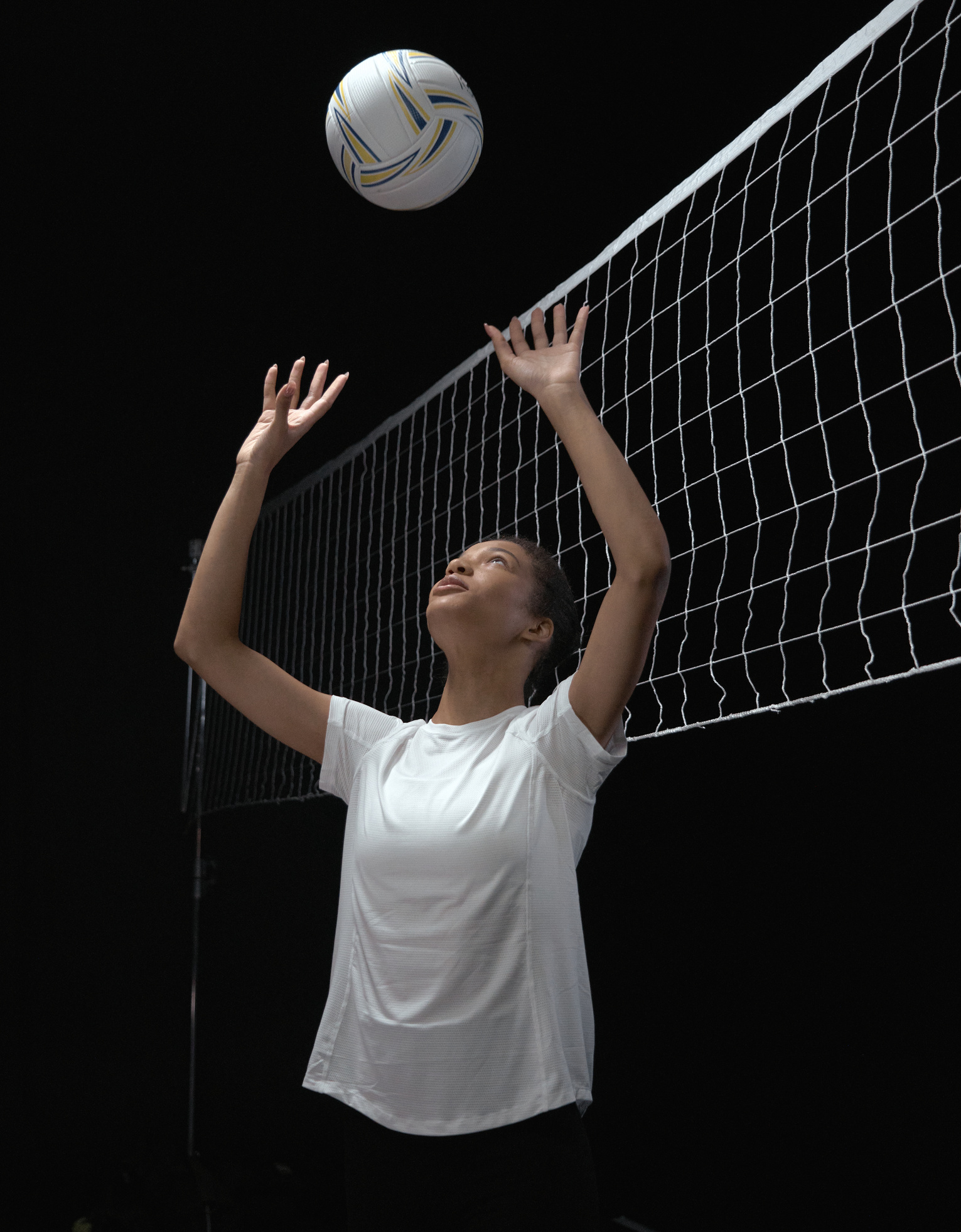 Woman in White Shirt Playing Volleyball